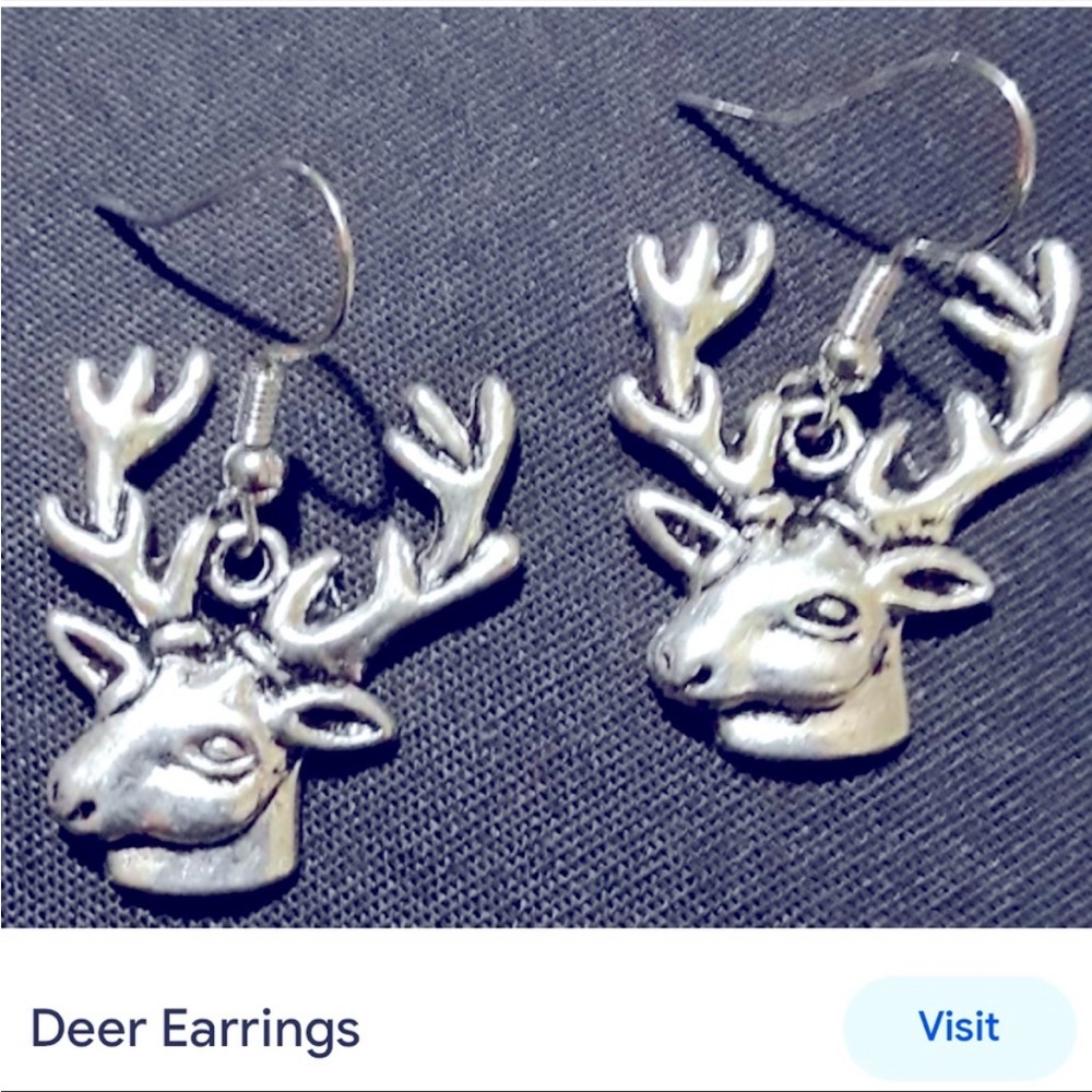 New silver reindeer earrings two inch drop length